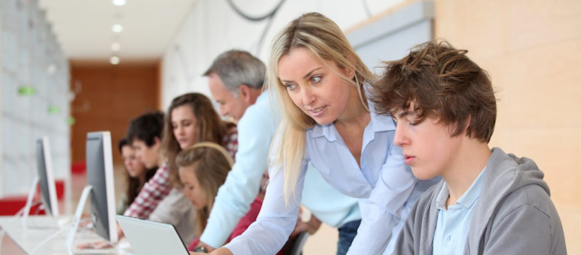 Group of students attending training course at school